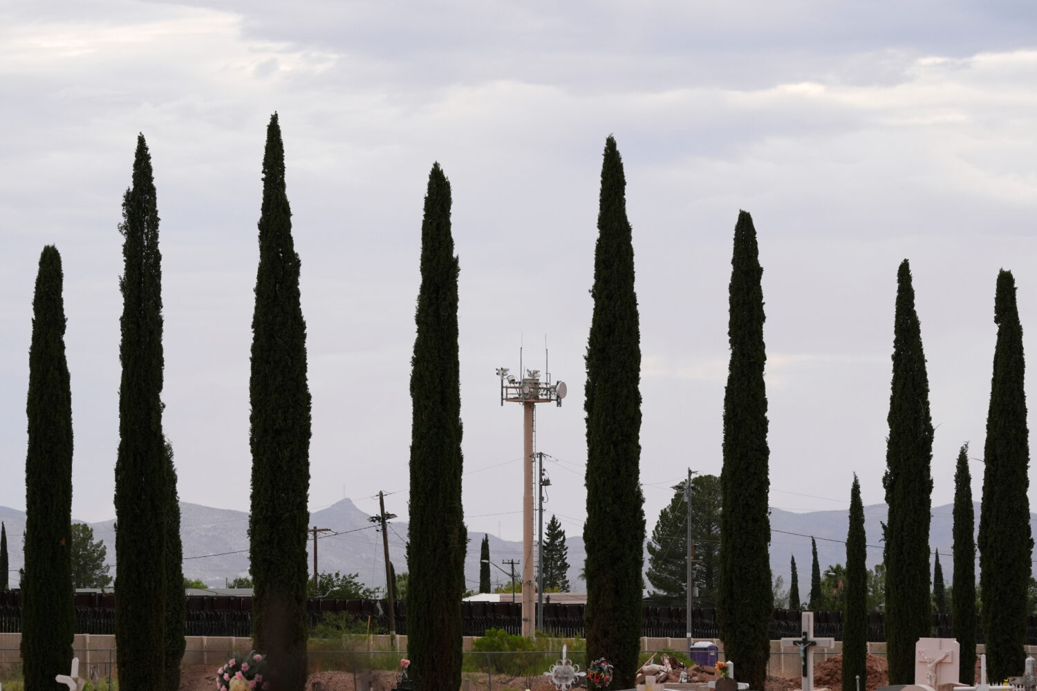 FILE - Surveillance technology used by various law enforcement sit on a tower at the border wall, J...