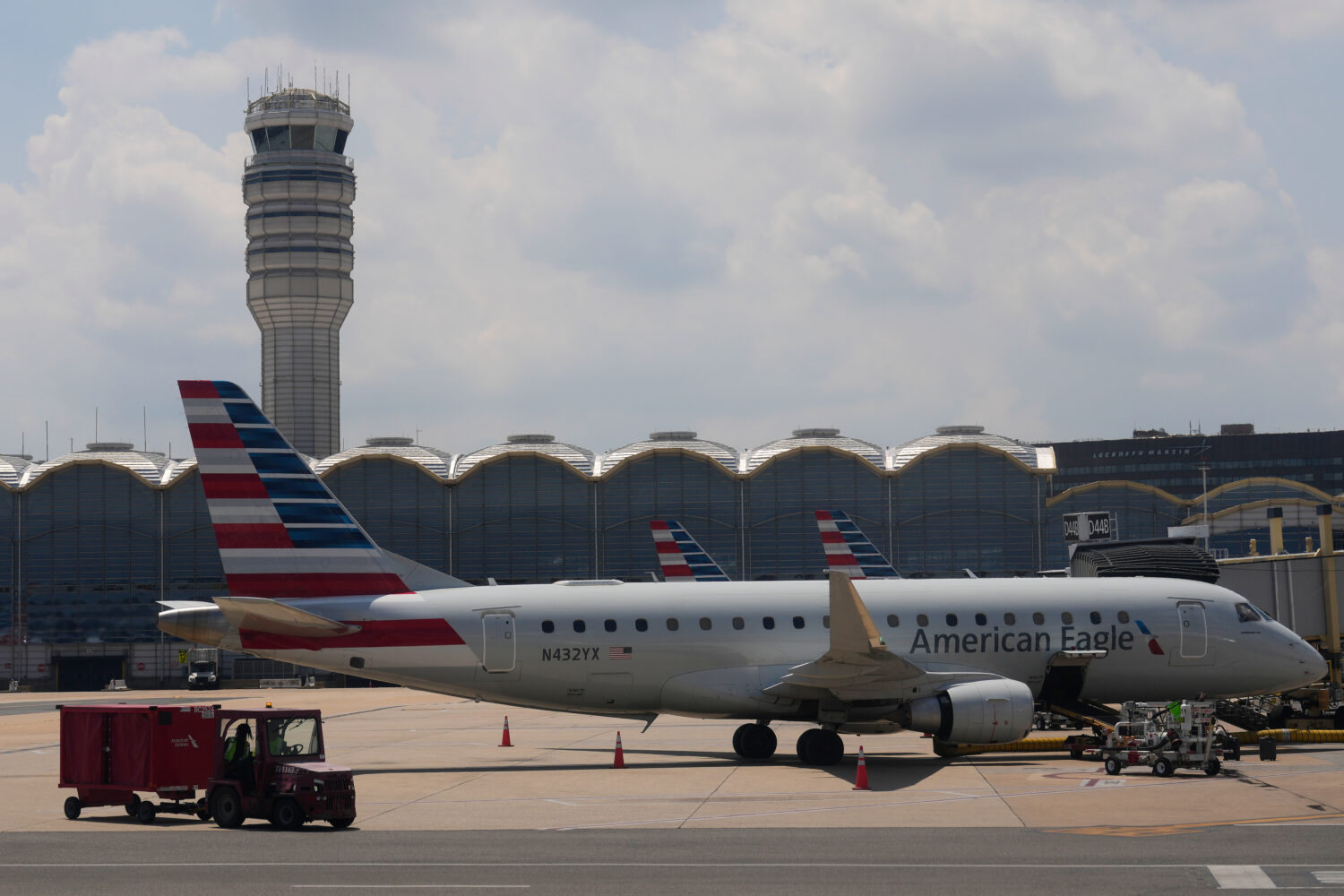 FILE - An American Eagle plane is parked at a gate at the Ronald Reagan Washington National Airport...