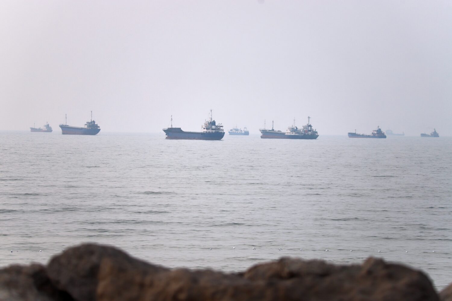 Commercial vessels are seen in the Strait of Hormuz off Bandar Abbas, Iran, Tuesday, June 30, 2026....