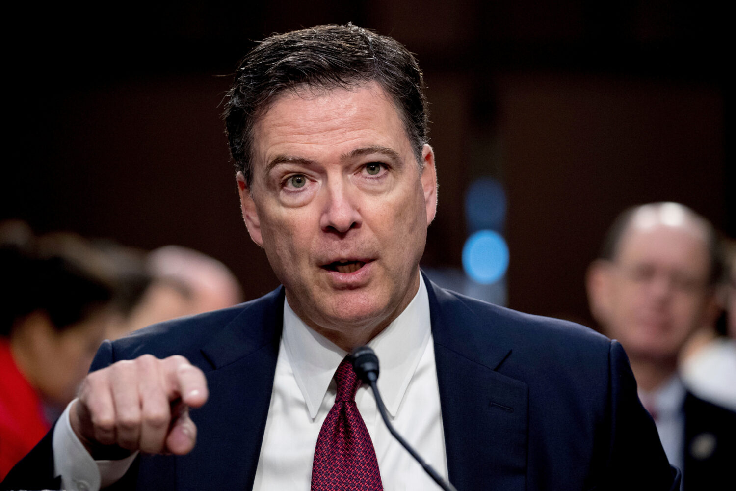 FILE - Former FBI Director James Comey speaks during a Senate Intelligence Committee hearing on Cap...