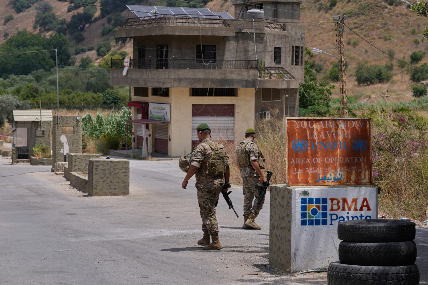 Lebanese army soldiers stand at a checkpoint in Froun village, southern Lebanon, Thursday, July 16,...
