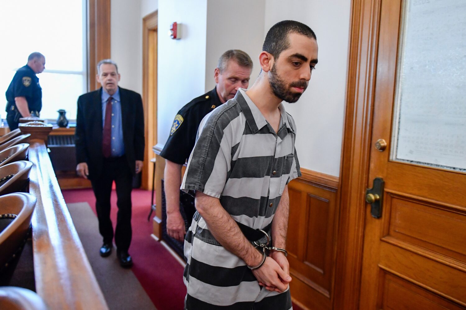 FILE - Hadi Matar walks in to the Chautauqua County court in Mayville, N.Y., May, 16, 2025. (AP Pho...