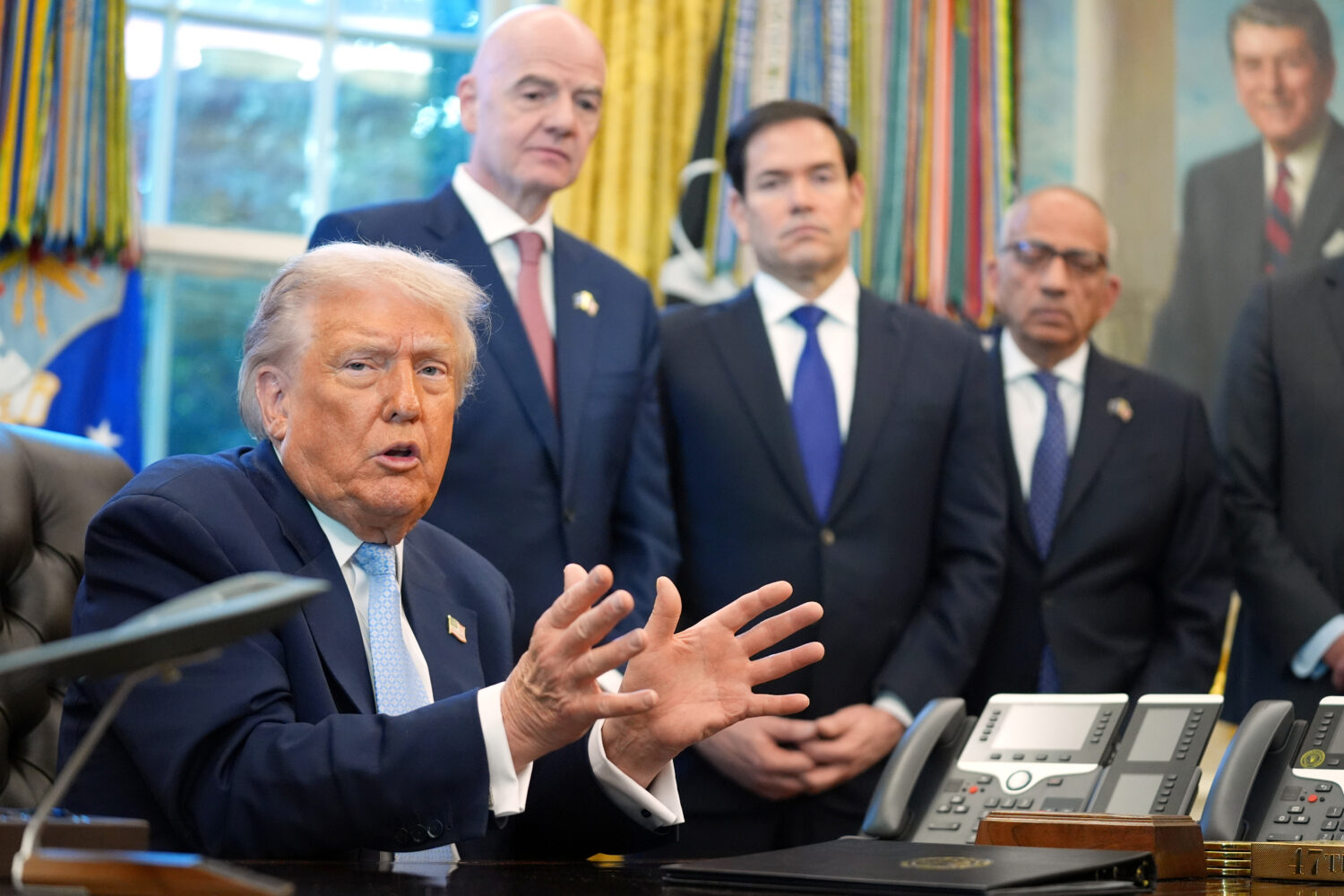 FILE - President Donald Trump answers questions from reporters during a meeting with the White Hous...
