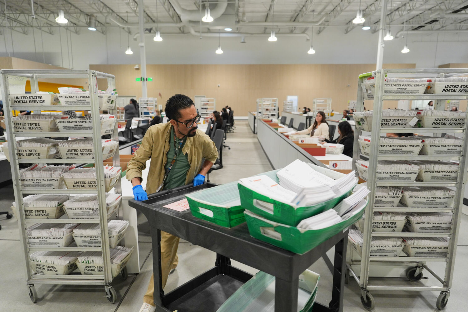 FILE - Ballots are sorted the day after California's primary election at the LA County Ballot Proce...