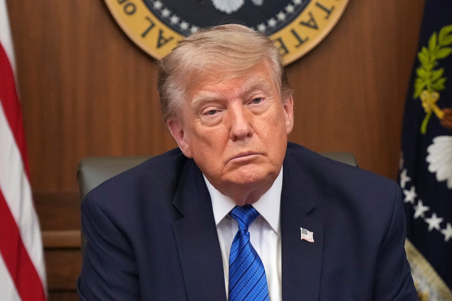President Donald Trump listens during a cabinet meeting, Friday, July 31, 2026, at Camp David, the ...