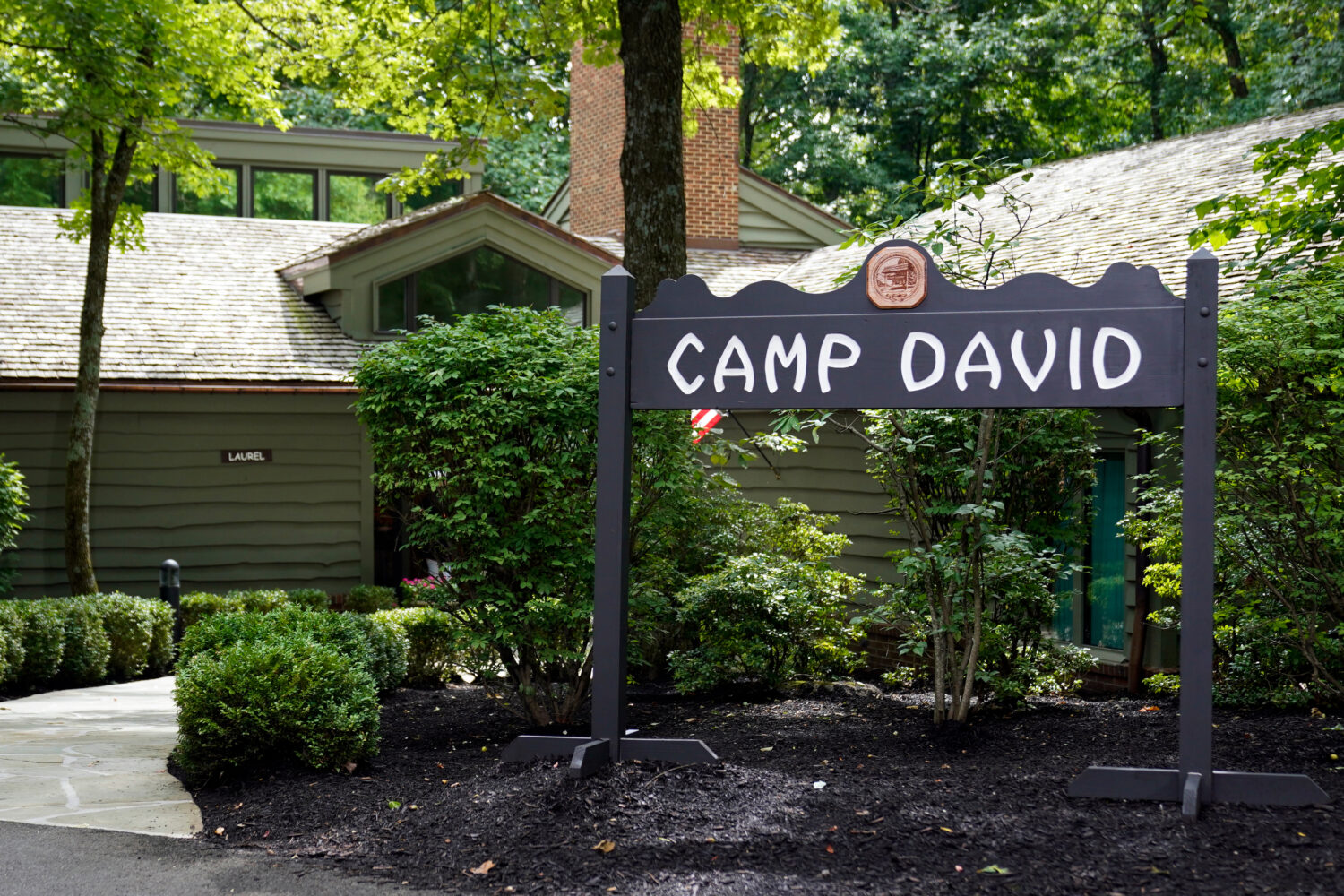 FILE - A sign for Camp David, the presidential retreat, is pictured near Thurmont, Md., Aug. 18, 20...