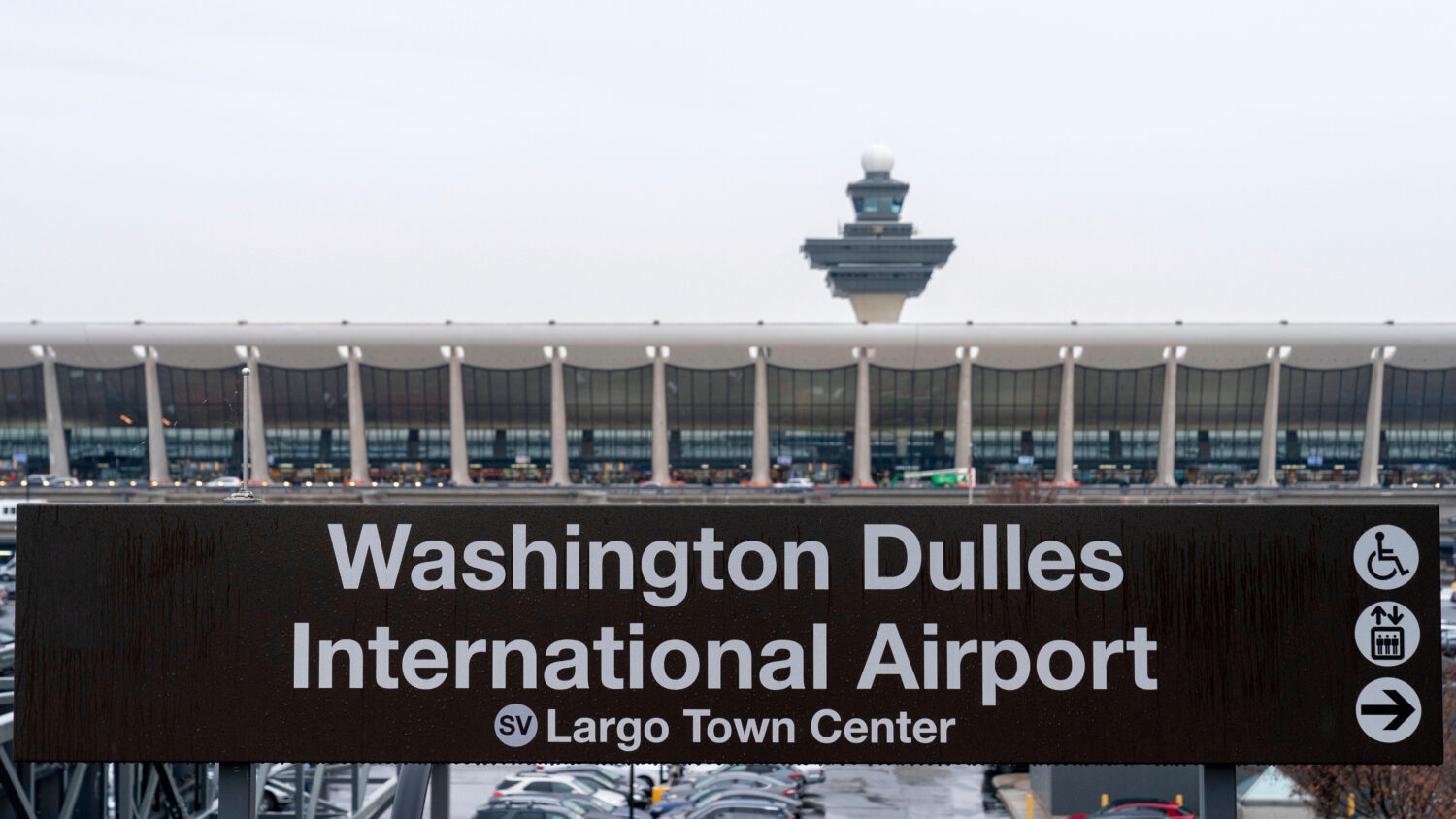 FILE - A sign of Washington Dulles International Airport station is seen during the opening of new ...