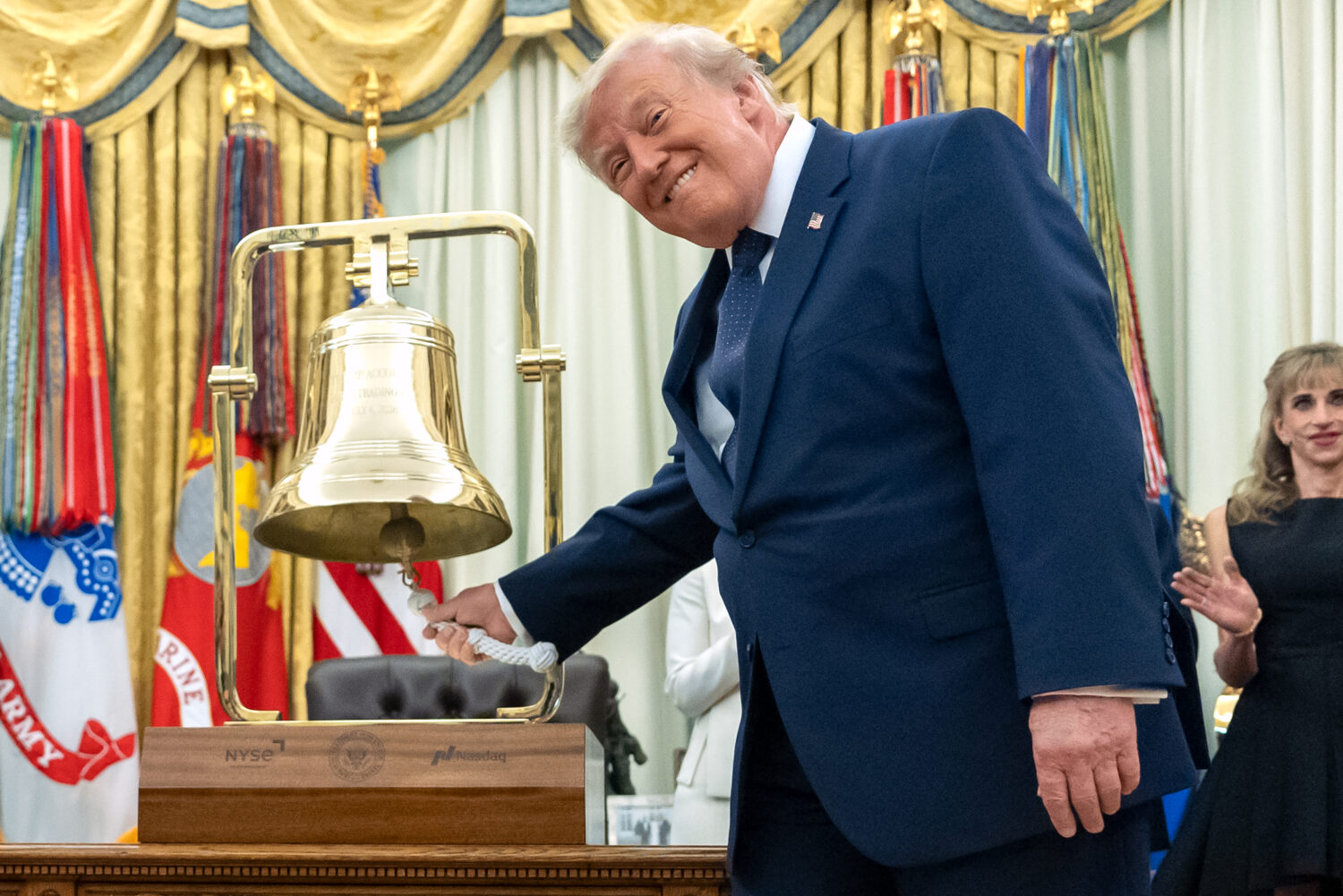 President Donald Trump rings the opening bell for the New York Stock Exchange and the Nasdaq in the...