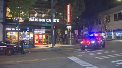 Shooting outside University District Raising Cane's sends 1 to hospital, suspect at large