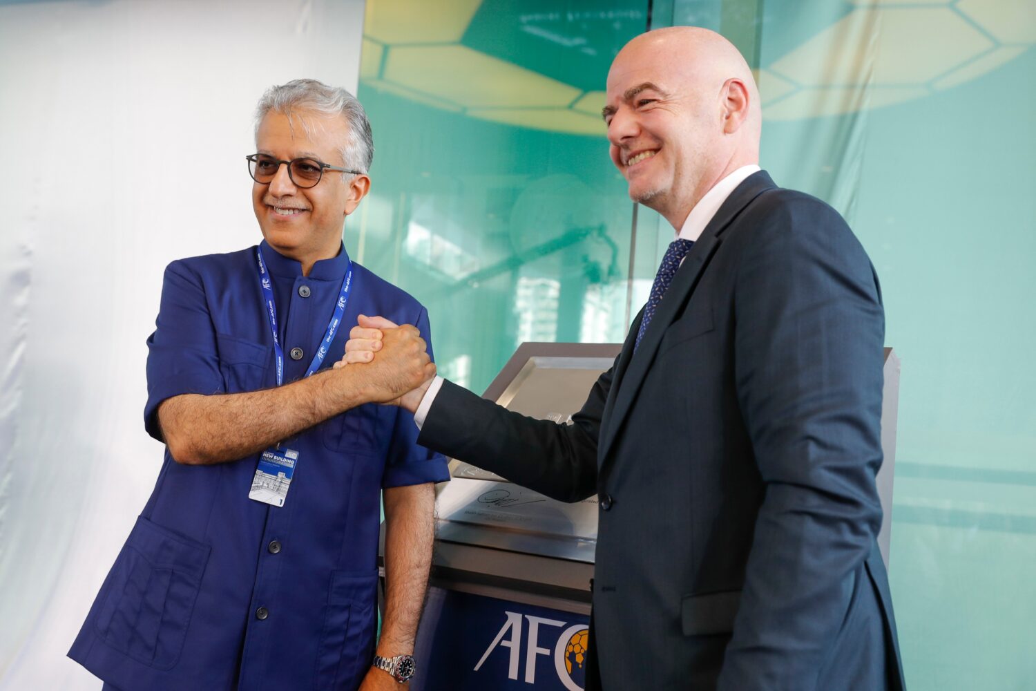 FILE - Asia Football Confederation President Salman Bin Ibrahim Al-Khalifa, left, poses with FIFA P...