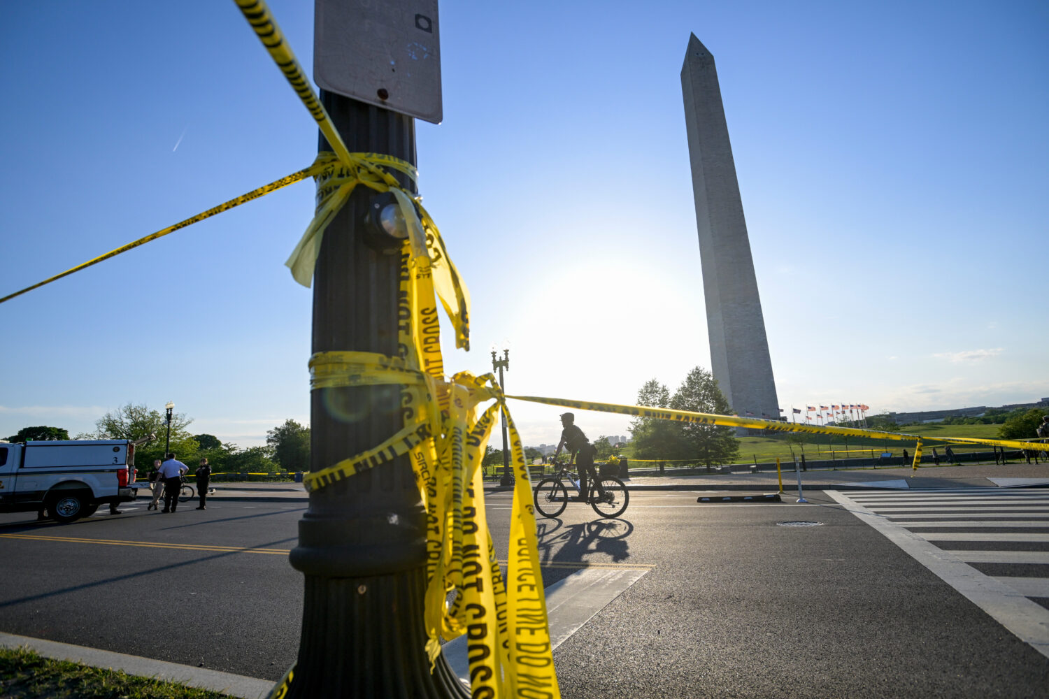 FILE - Police tape remains around the scene after a person was shot near the Washington Monument in...