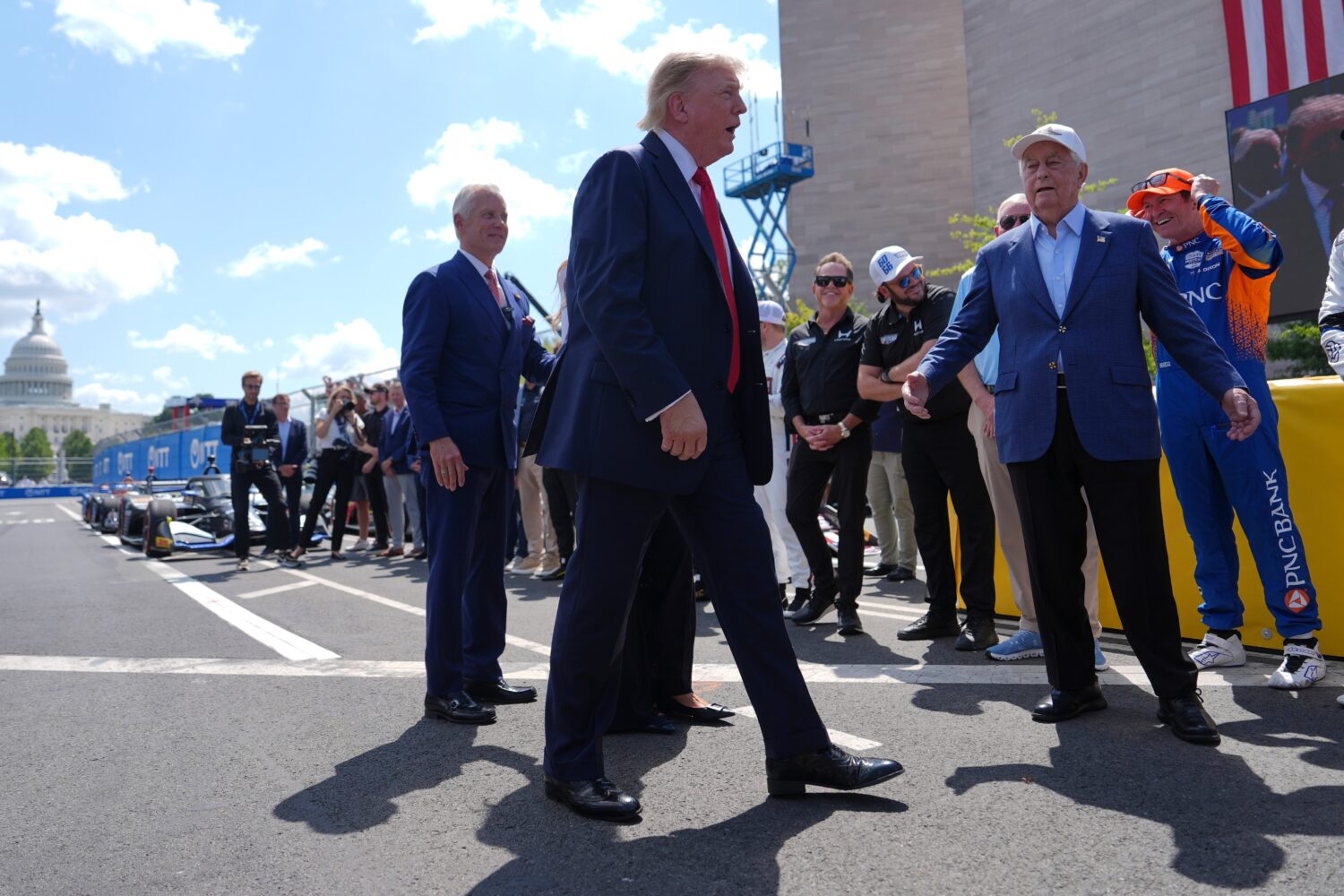 President Donald Trump arrives at the IndyCar Freedom 250 Grand Prix auto race, Sunday, Aug. 23, 20...