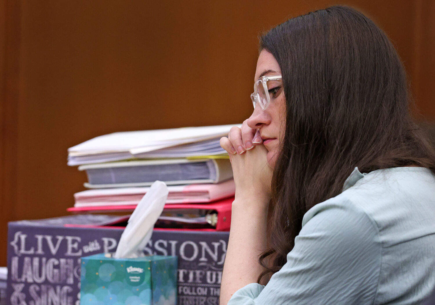Lindsay Clancy listens to her mother Paula Musgrove on the witness stand during her murder trial in...