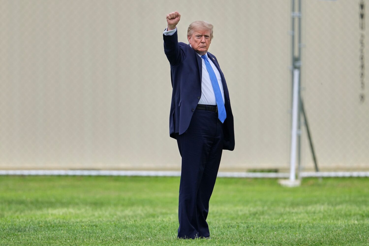 President Donald Trump gestures as he walks to board Marine One on the Ellipse, Friday, Aug. 14, 20...