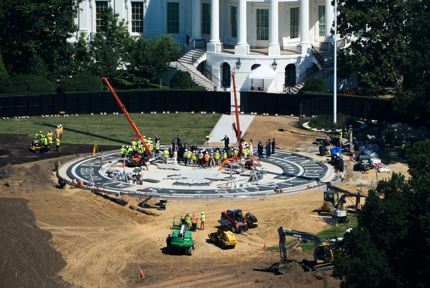 President Donald Trump speaks on the South Lawn of the White House at the construction site of the ...