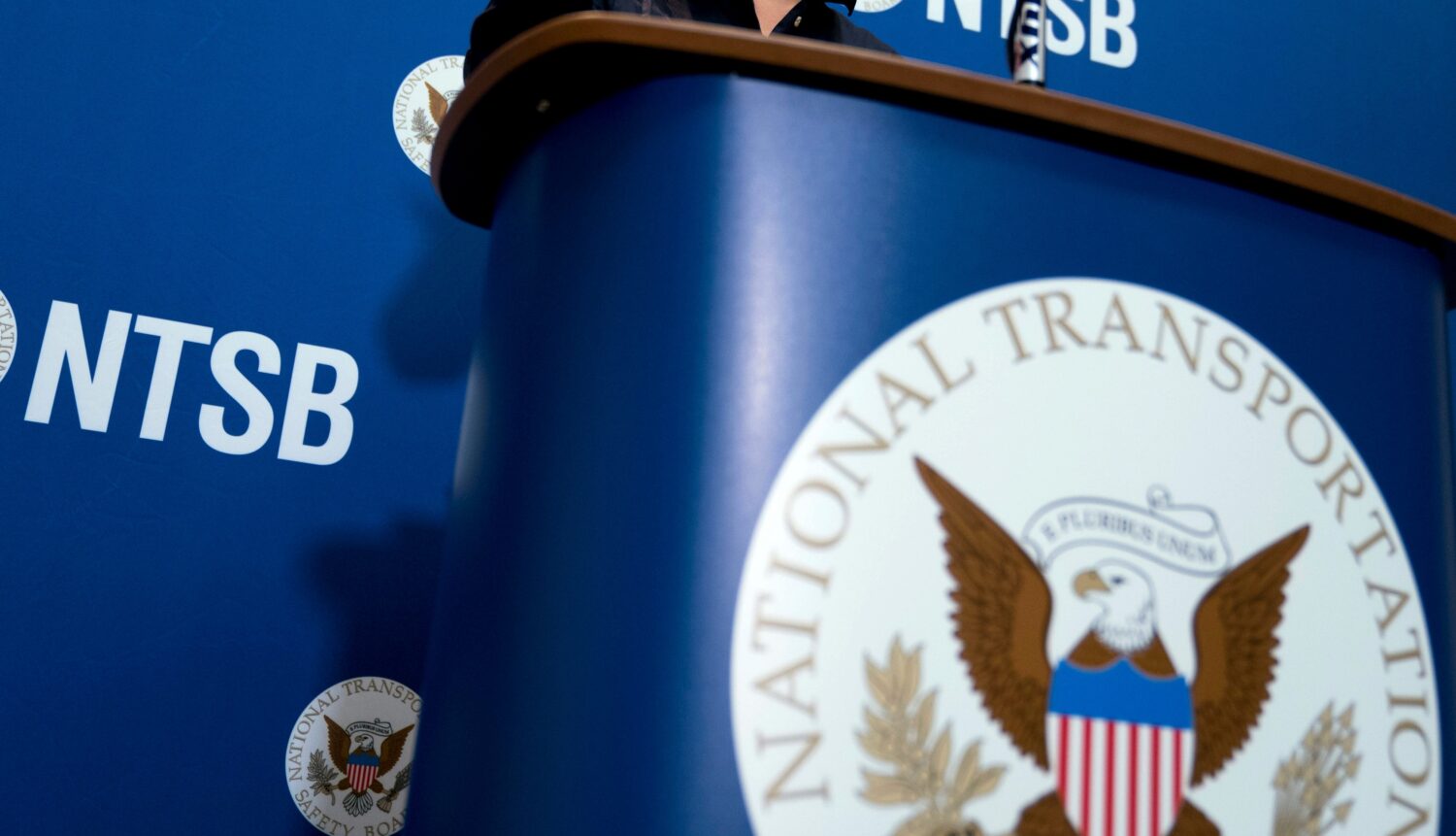FILE - The National Transportation Safety Board logo and signage are seen at a news conference at N...