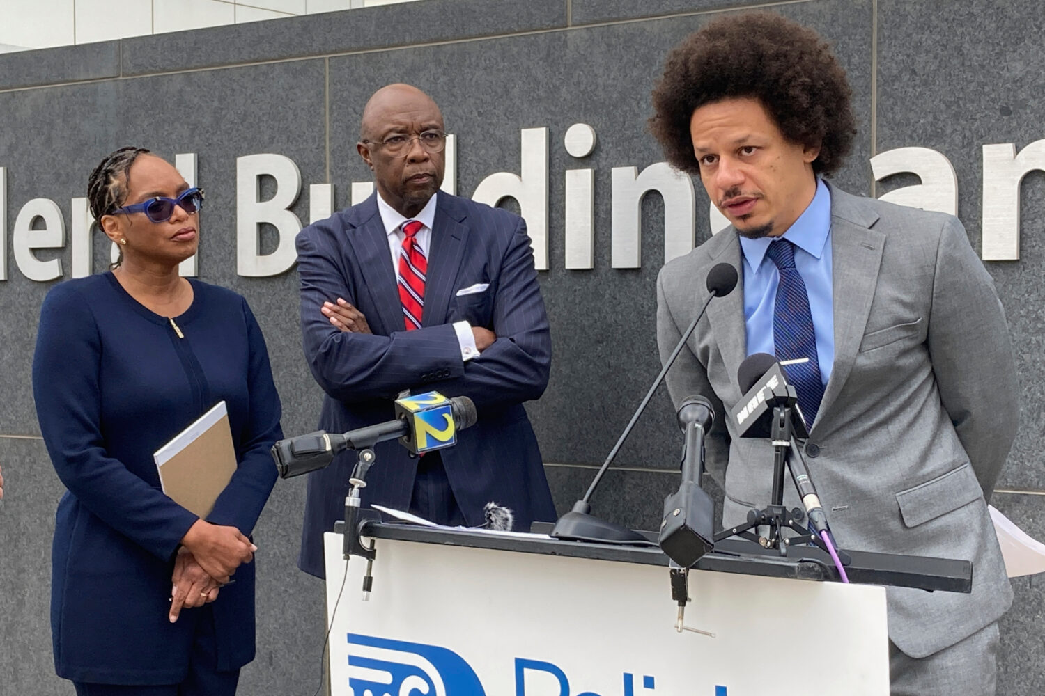 FILE - Comedian Eric André, right, speaks at a news conference outside the federal courthouse in A...