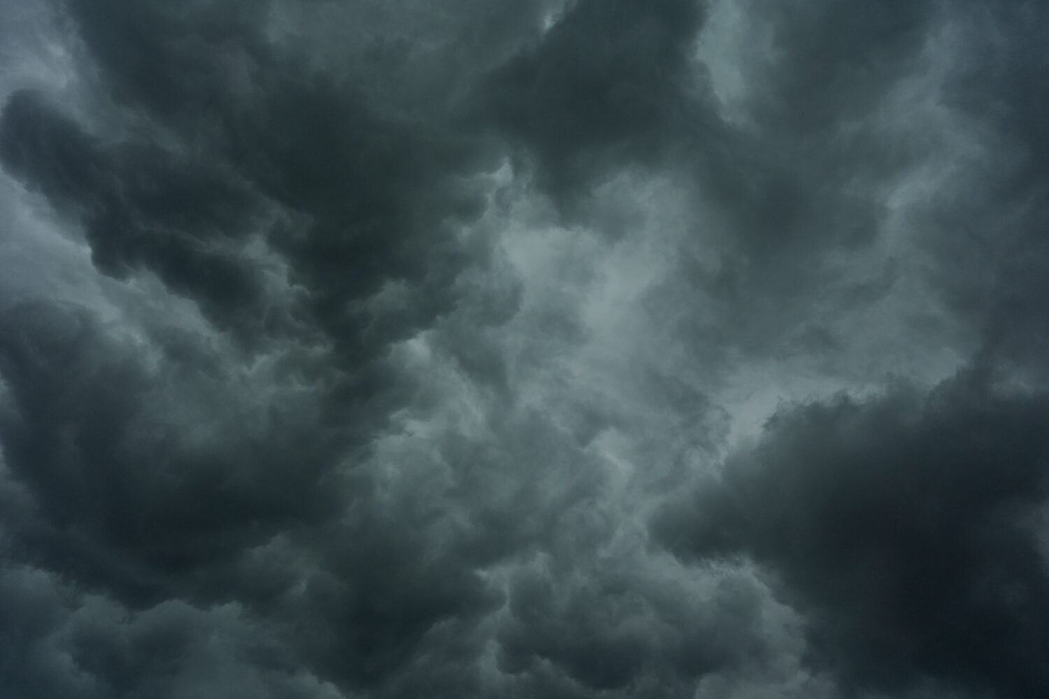 Storm clouds are seen over the Cincinnati Bengals NFL football practice in Cincinnati, Tuesday, Aug...