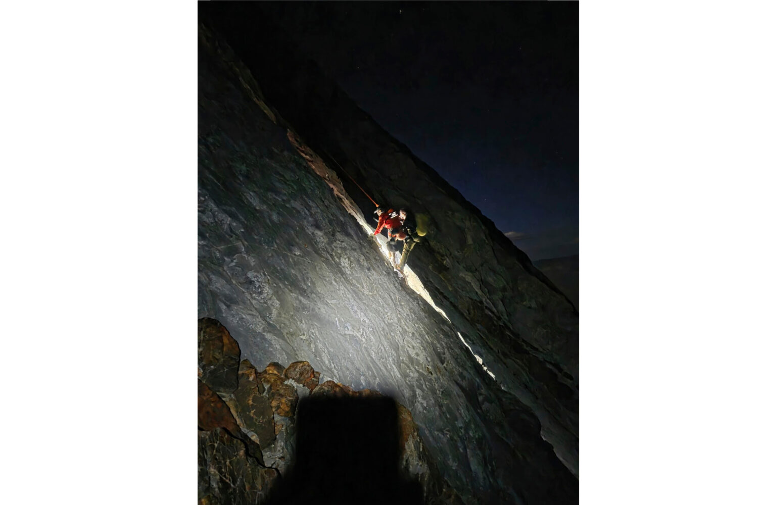 This photo released by Mono County Sheriff Search and Rescue, shows a rescuer with the man who was ...