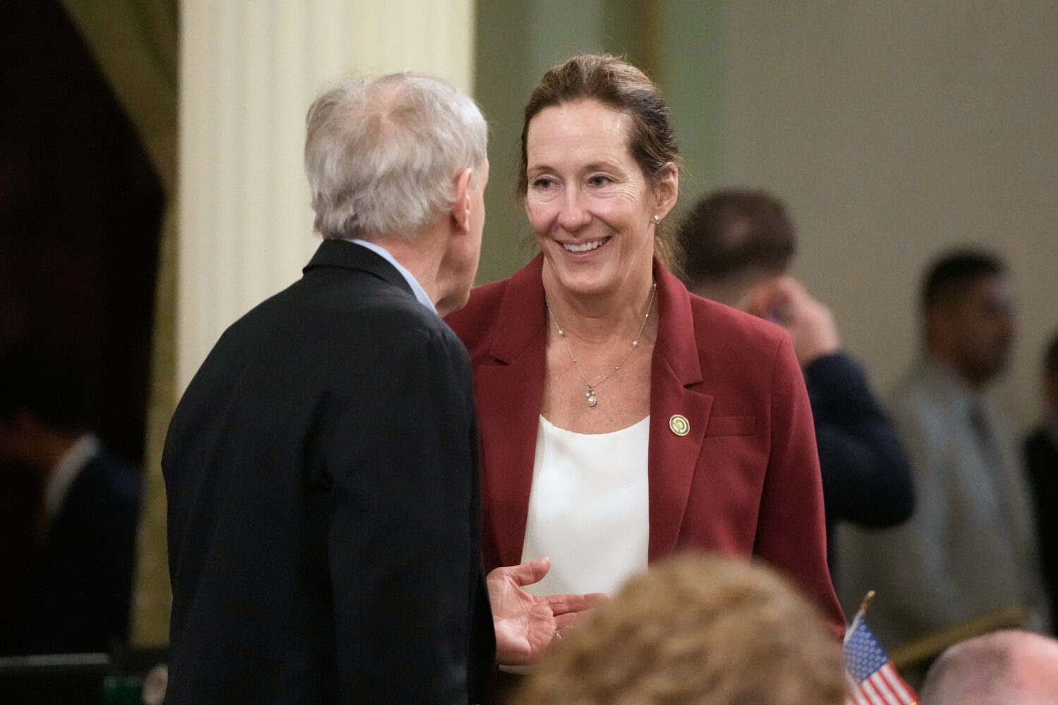 Assemblymember Jacqui Irwin, right, talks with Assemblymember Steve Bennett during an Assembly sess...