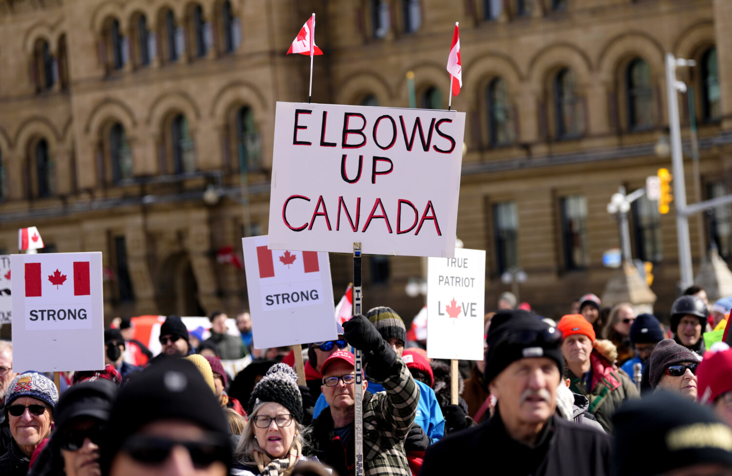 FILE - People rally in response to U.S. President Donald Trump's threats to Canadian sovereignty on...