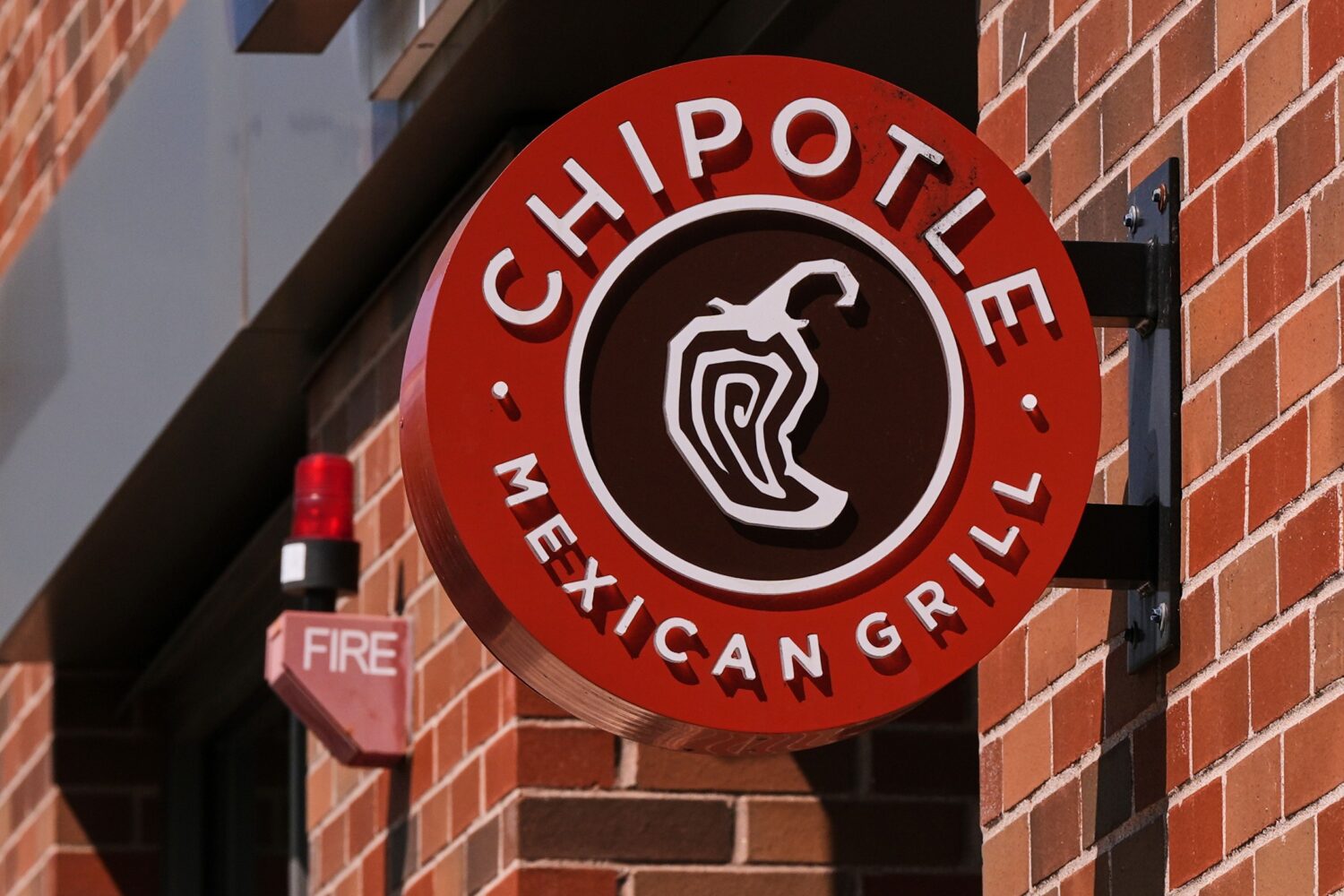FILE - The Chipotle logo is displayed at a store, Aug. 13, 2025, in Newton, Mass. (AP Photo/Charles...