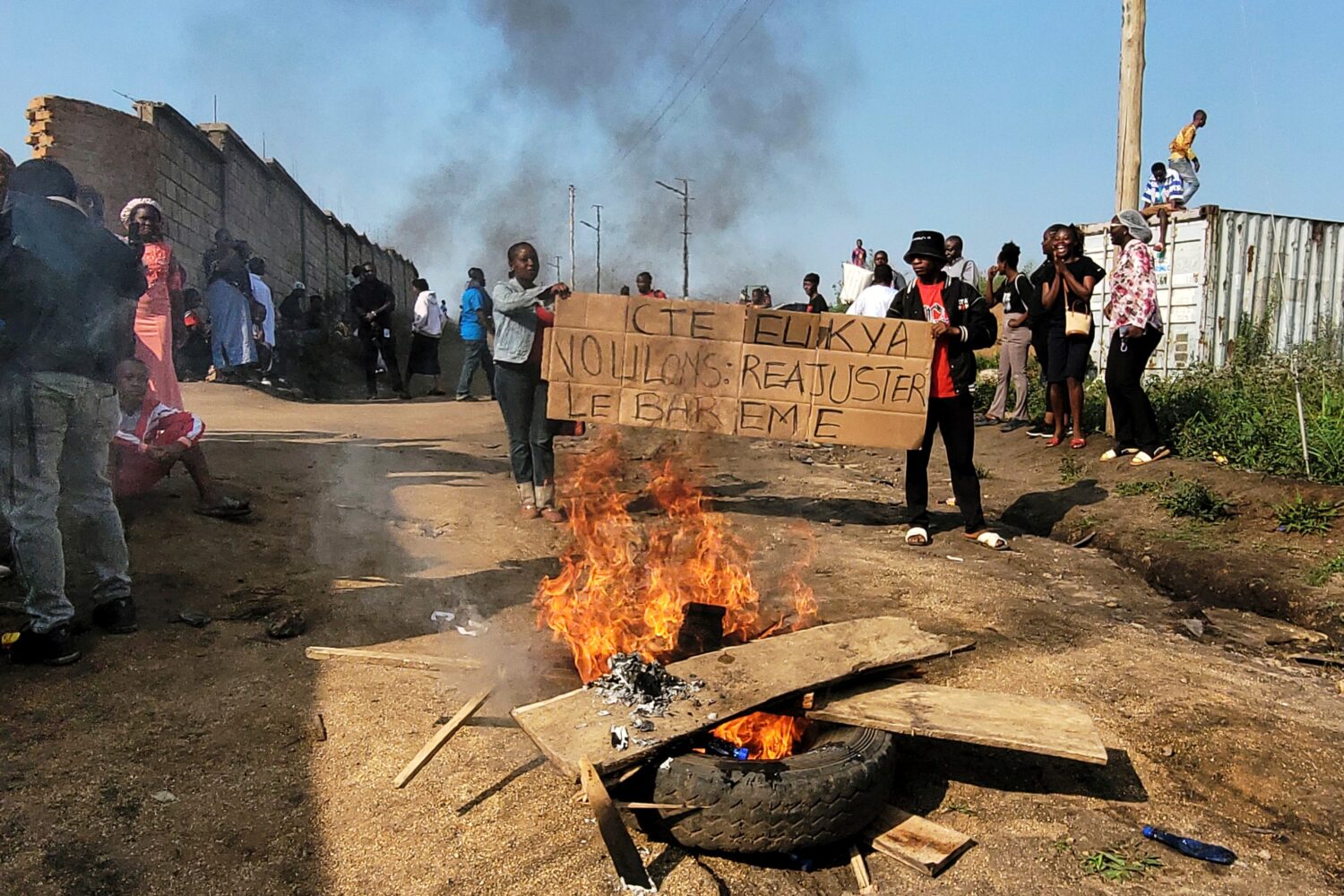 Rubble set on fire as health and frontline workers protest at the Elikya Ebola Treatment Center in ...