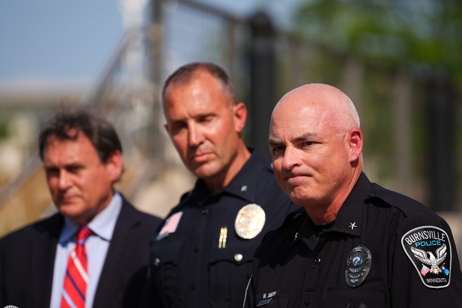 Burnsville Police Chief Matt Smith, right, attends a news conference in Hopkins, Minn., Wednesday, ...