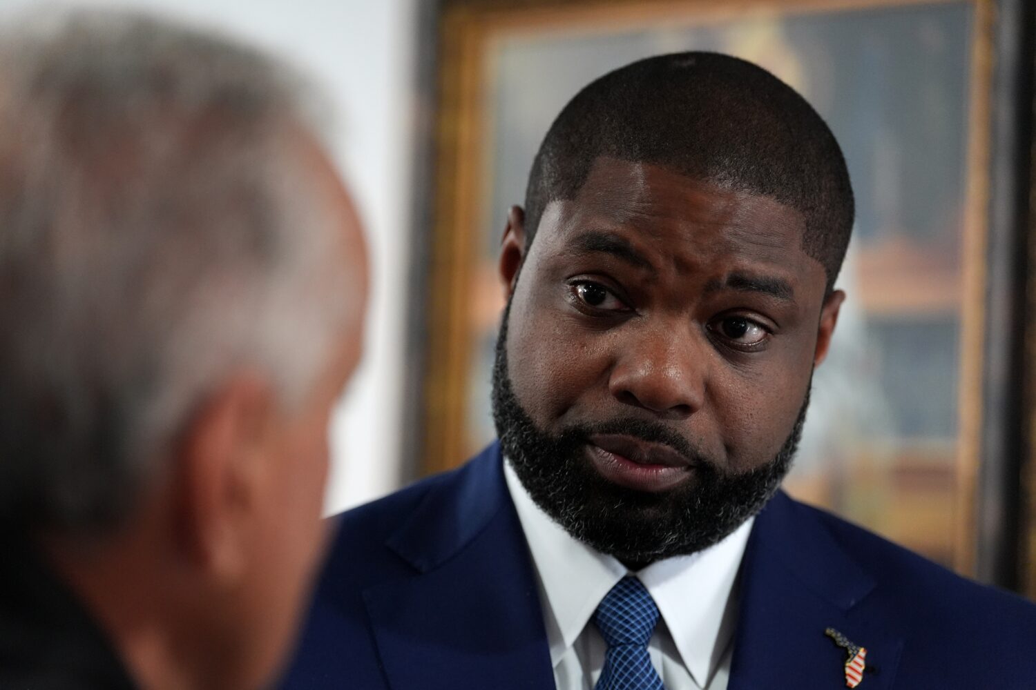 Florida Republican congressman and gubernatorial candidate Byron Donalds talks with a member of the...