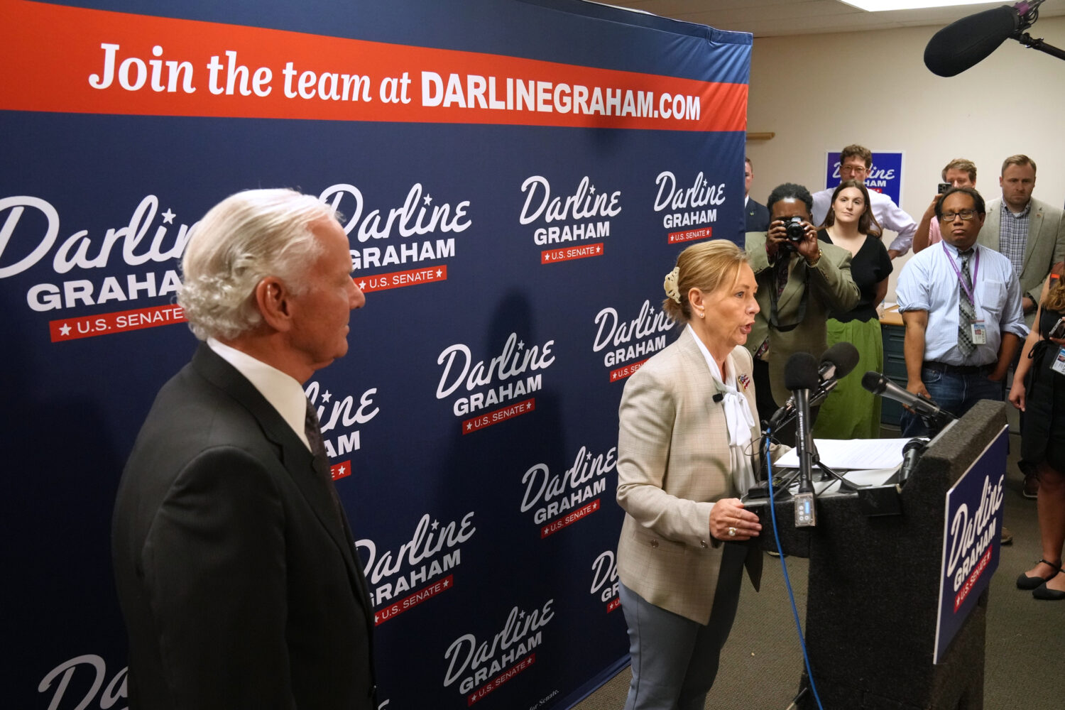Gov. Henry McMaster, R-S.C., left, looks on as Sen. Darline Graham, R-S.C., speaks at a news confer...