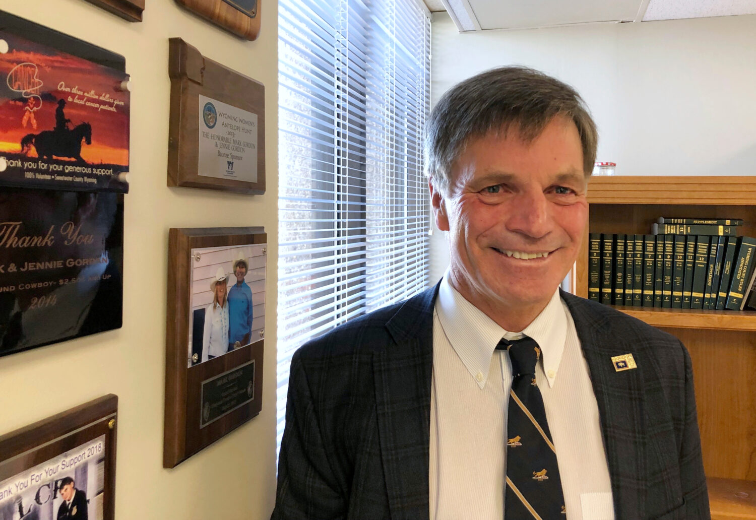 FILE - Wyoming Gov. Mark Gordon poses for a photo in a state office in Cheyenne, Wyo., Dec. 18, 201...