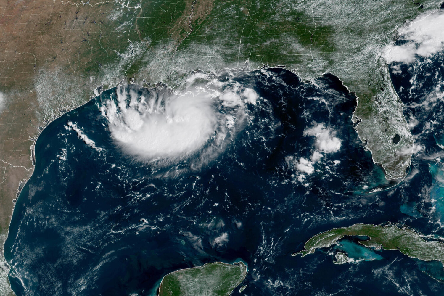 This satellite image released by NOAA shows Potential Tropical Cyclone Five forming over the Gulf o...