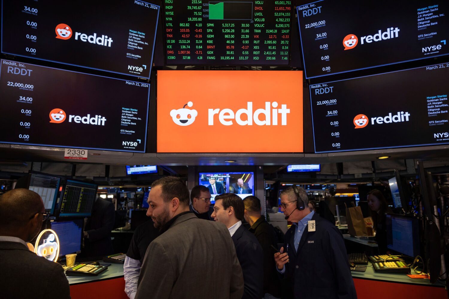 FILE - Reddit Inc. logos are displayed on the New York Stock Exchange trading floor, prior to the c...