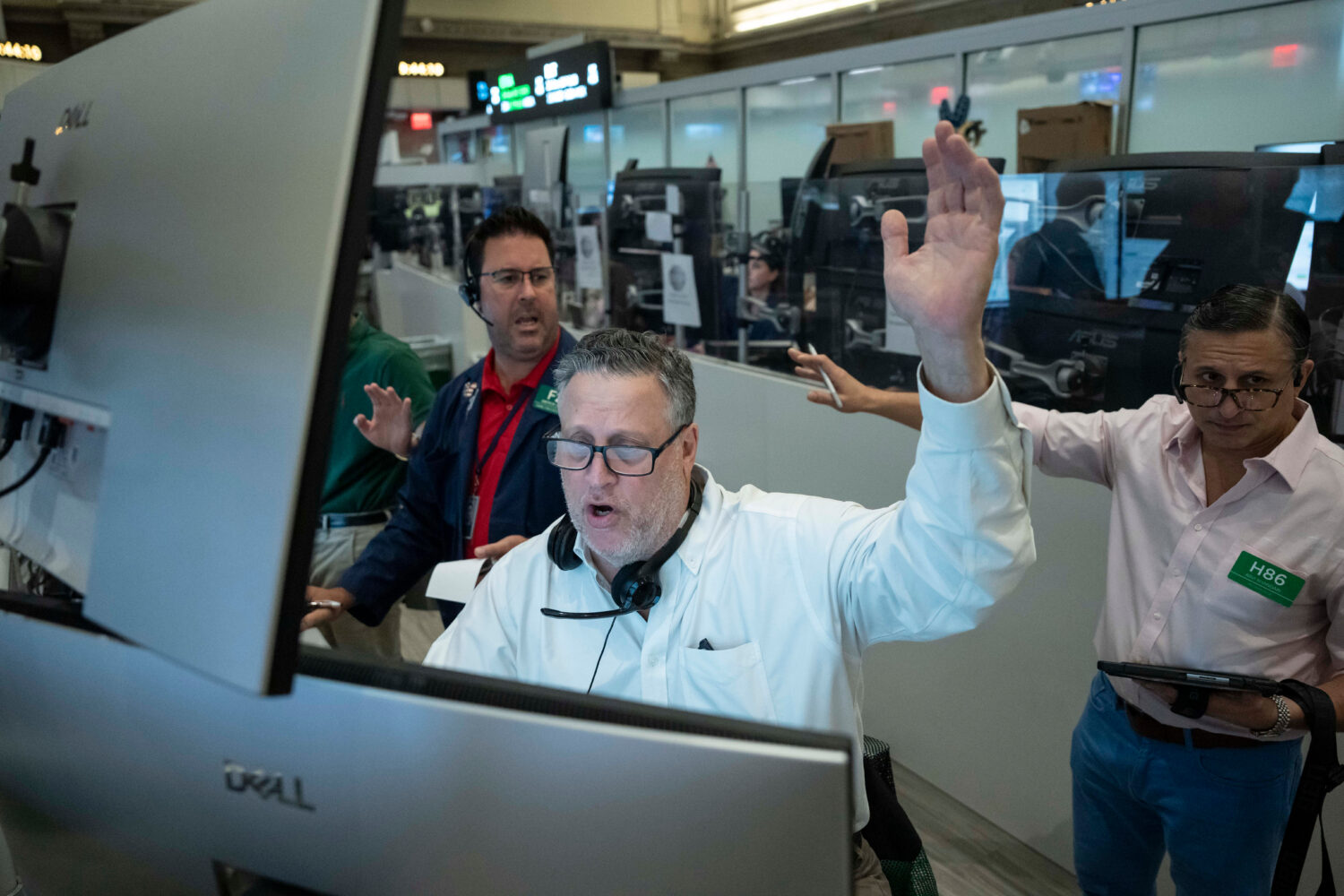 Options trader Marty Handler works on the floor of the New York Stock Exchange, Thursday, Aug. 27, ...