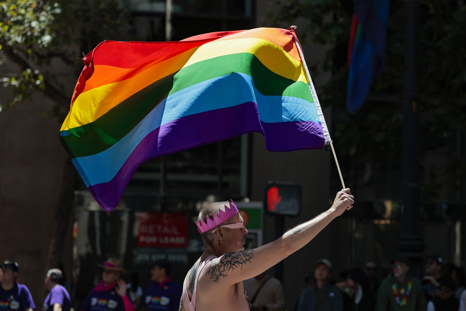 A person waves a pride flag. (Photo: Heather Diehl, Getty Images)...
