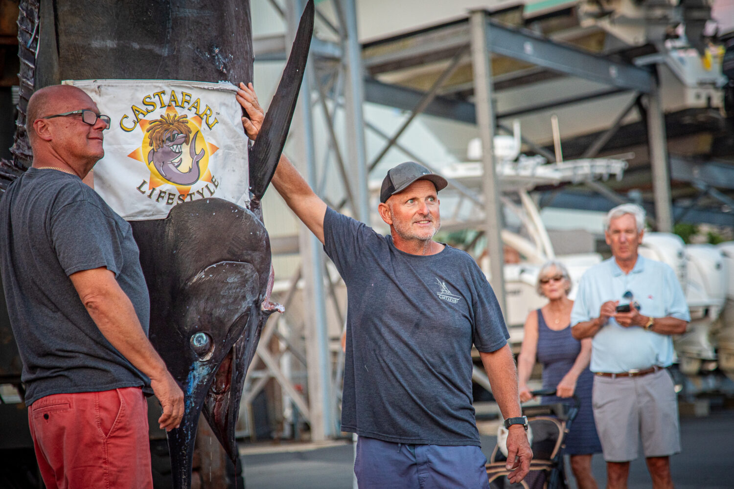 This photo provided by Jimmy Fee shows Walter Chapman, left, and Damon Sacco, captain of the Castaf...