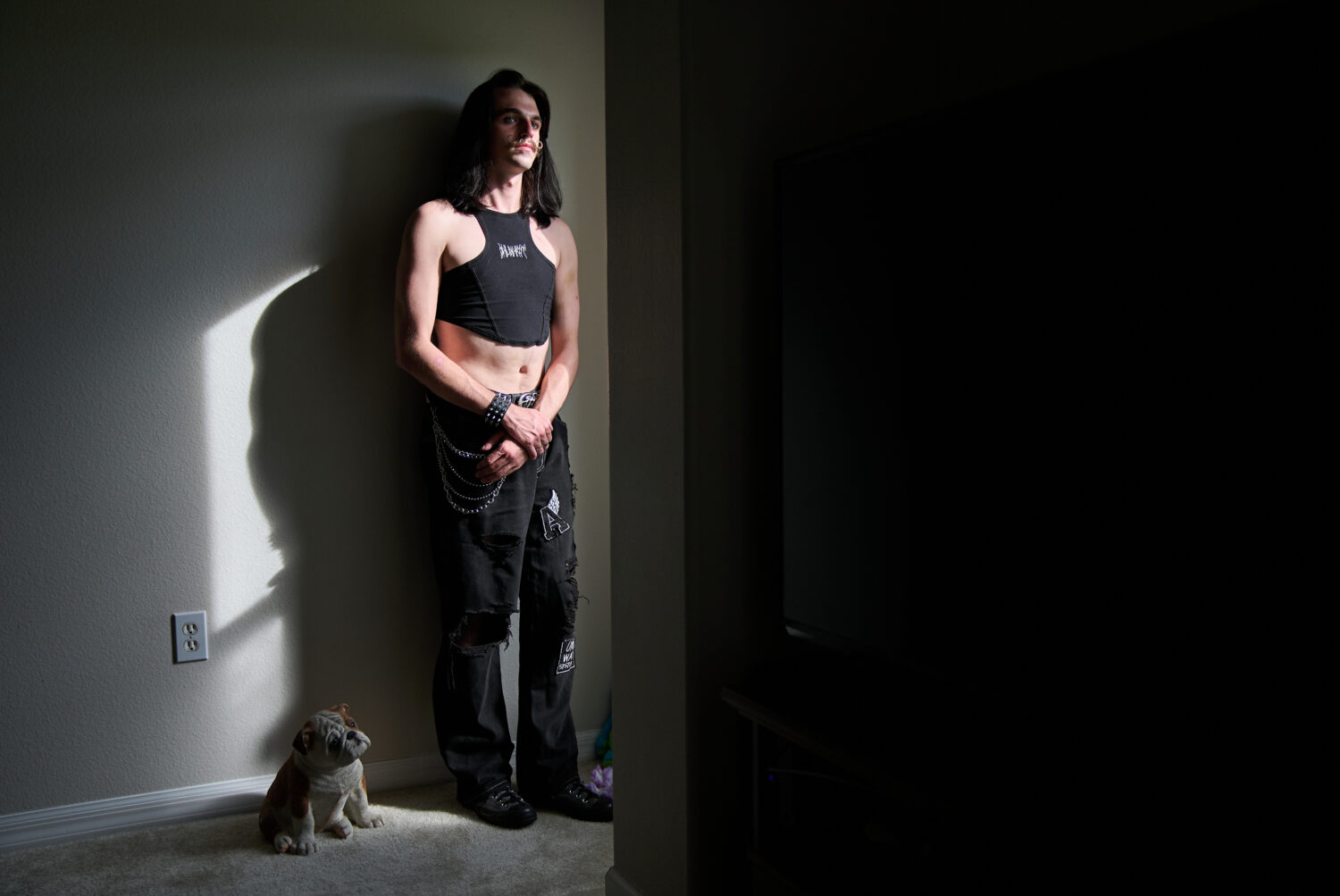 Elijah Button, 21, poses for a portrait in St. Cloud, Fla., Thursday, Aug. 13, 2026. (AP Photo/Jacq...