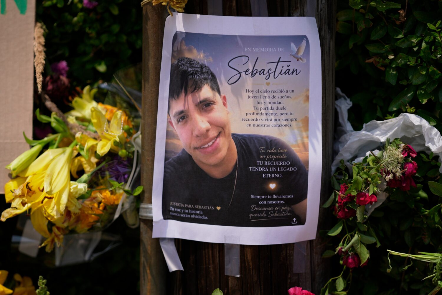 FILE - A poster of Johan Sebastián Durán Guerrero, a man killed by U.S. Immigration and Customs E...