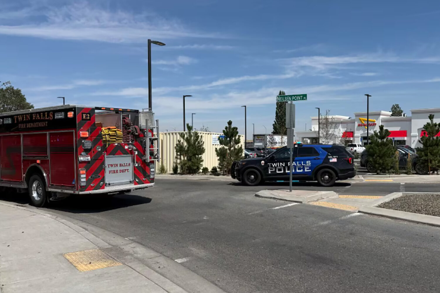 This image provided by KMVT shows the scene of a shooting that started at an In-N-Out Burger restau...