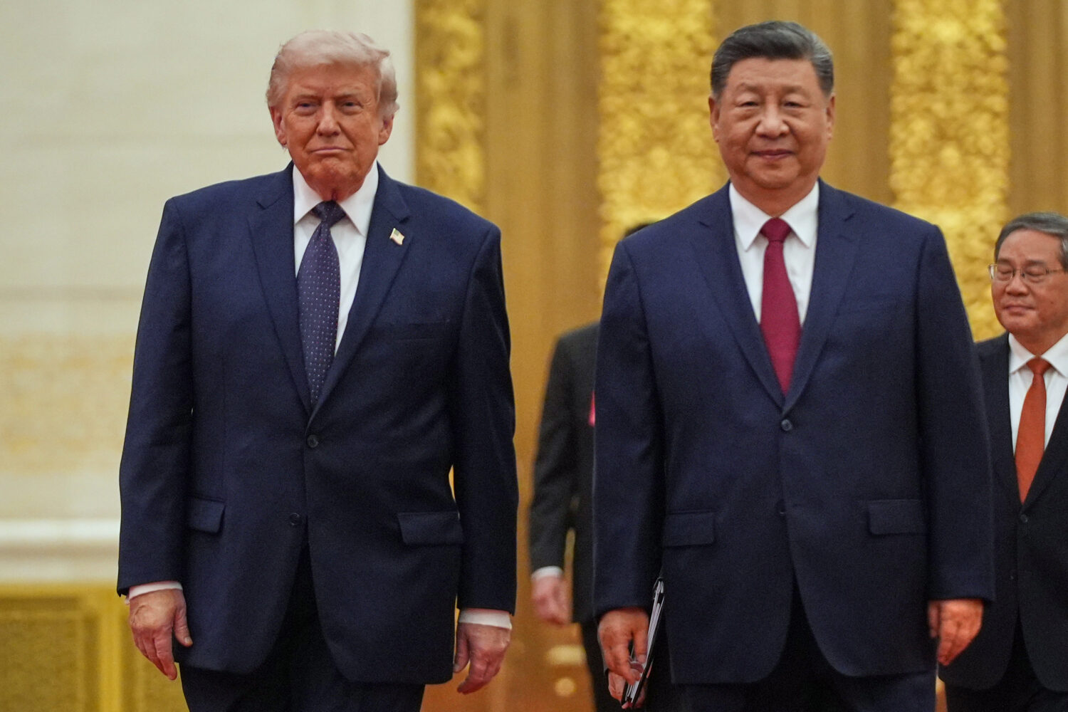 FILE - President Donald Trump, left, and Chinese President Xi Jinping arrive a state dinner at the ...