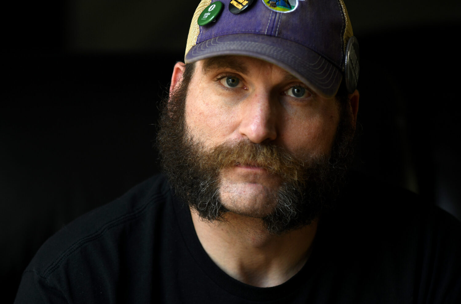 Joe Shearer, who was diagnosed with traumatic brain injuries from fighting in Iraq, poses for a por...