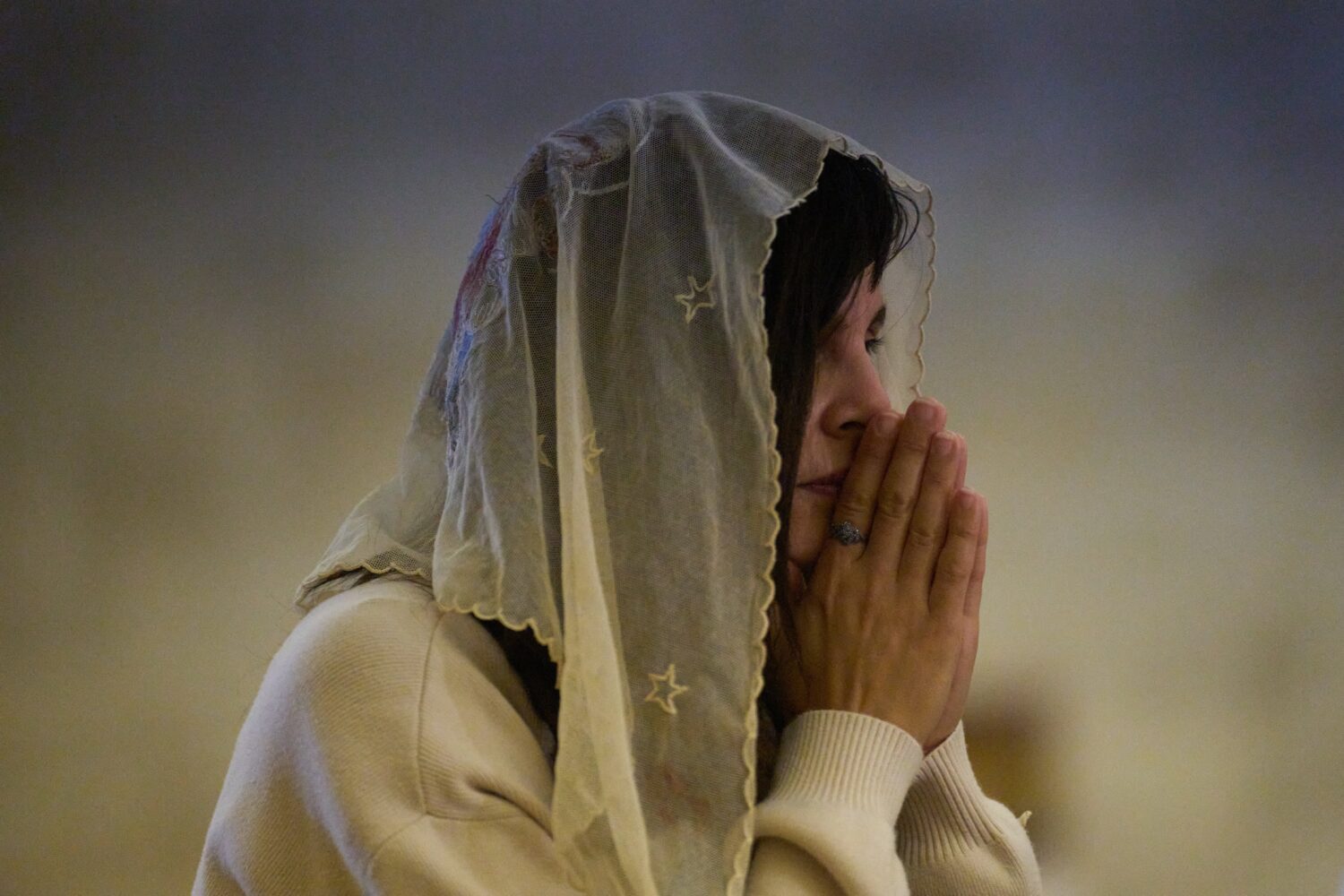 A Christian pilgrim attends a Mass in the Basilica of the Transfiguration on Mount Tabor, northern ...