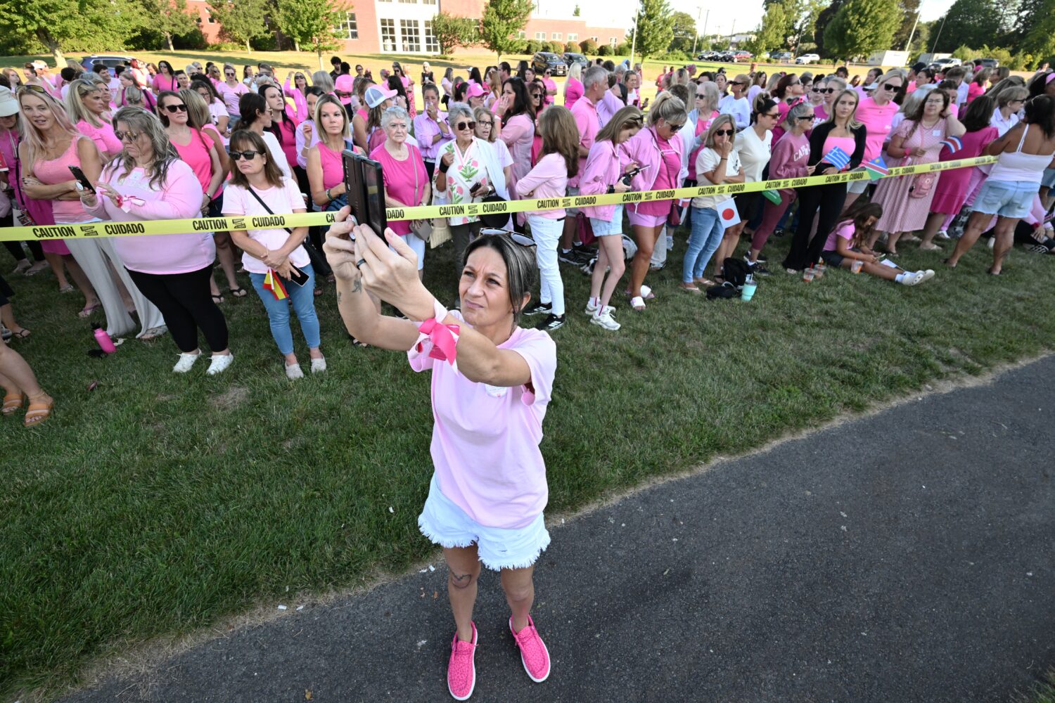 Aimee Breault of Acushnet, Mass., live-streams a demonstration in support of Lindsay Clancy outside...