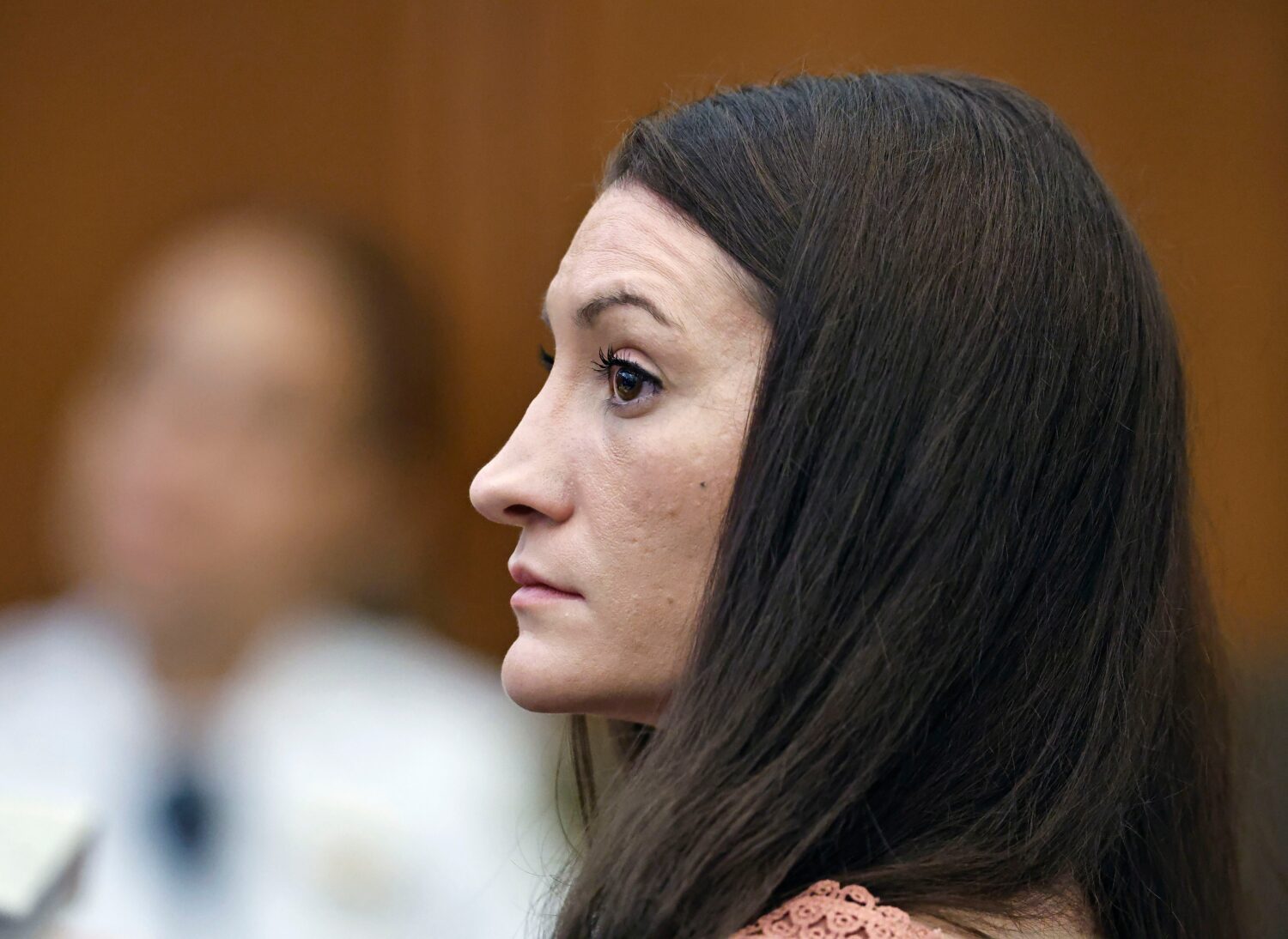Lindsay Clancy listens to a witness on video during her murder trial at Plymouth Superior Court, Mo...