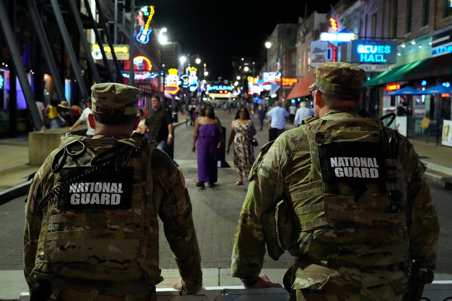 FILE - Members of the National Guard stand watch on Beale St., Friday, July 17, 2026, in Memphis, T...