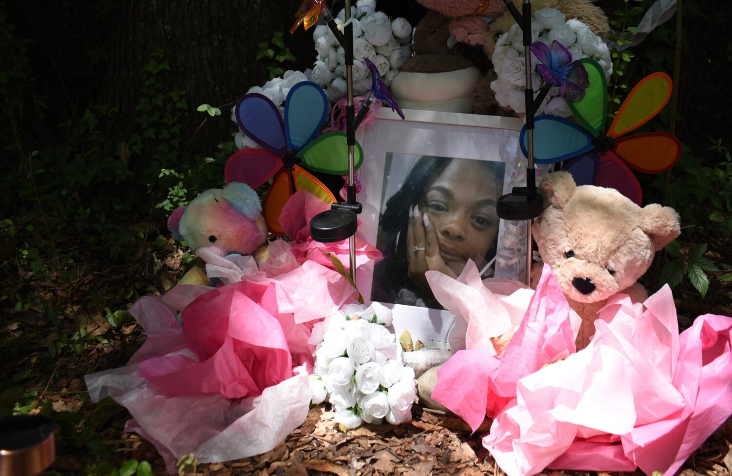 A makeshift memorial honoring Tasia Fortune stands in the backyard of the property where her body w...