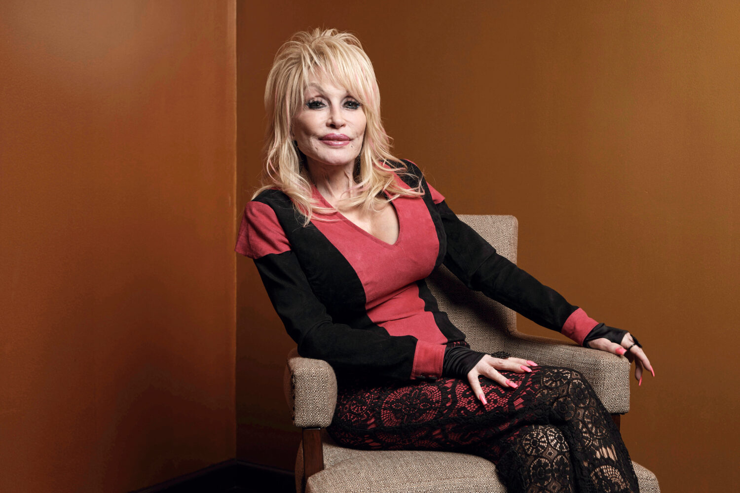 FILE - Dolly Parton poses at the Carnegie Medal of Philanthropy Ceremony in New York, on Oct. 13, 2...