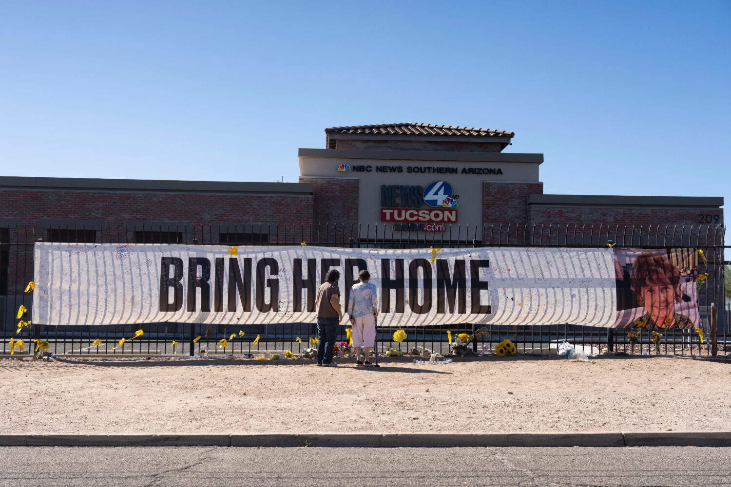 FILE - People visit a banner for Nancy Guthrie, the missing mother of "Today" show host Savannah Gu...