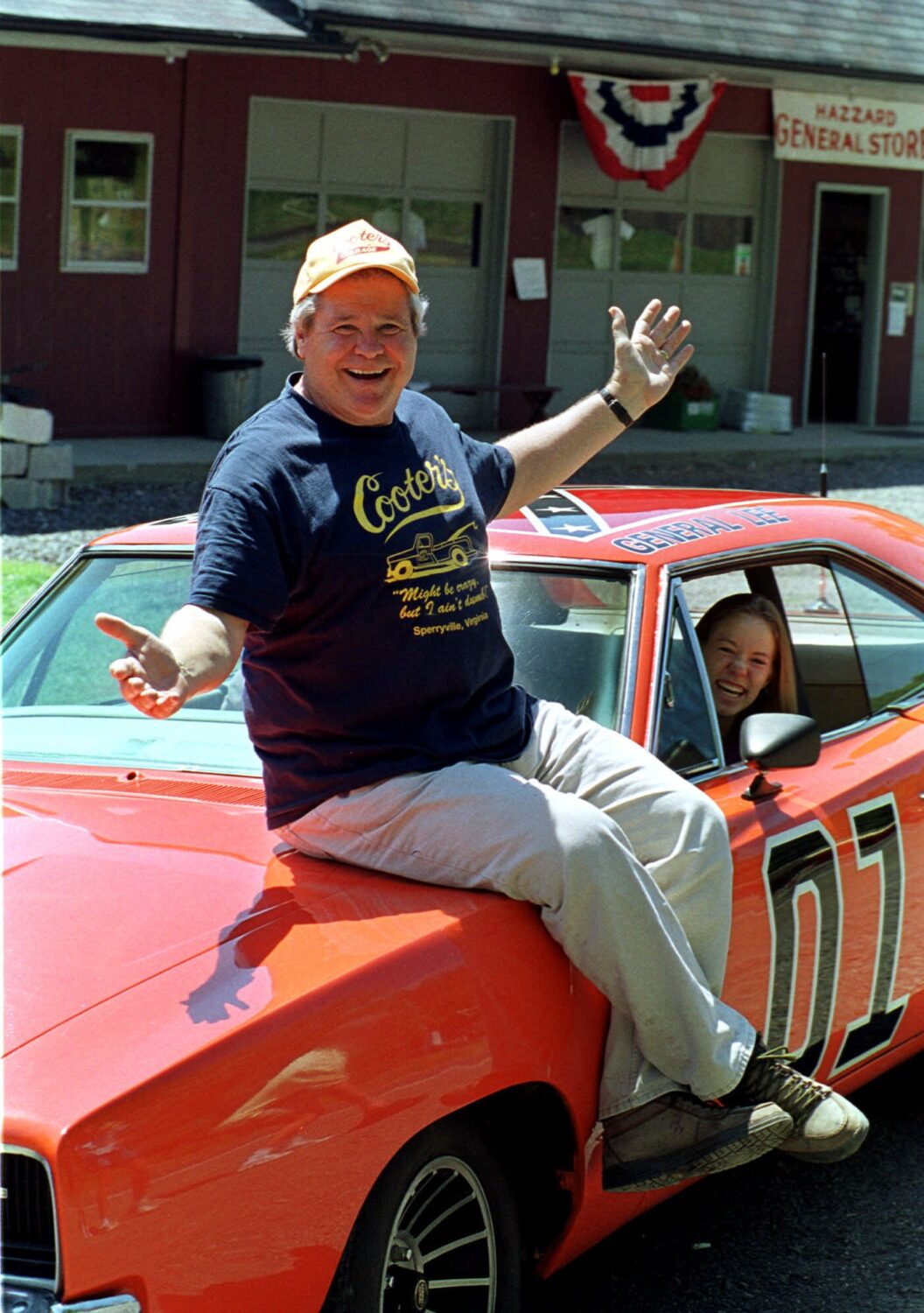 FILE - Cooter, actor Ben Jones, sits atop one of the 229 hotrods, named the General Lee, used in th...
