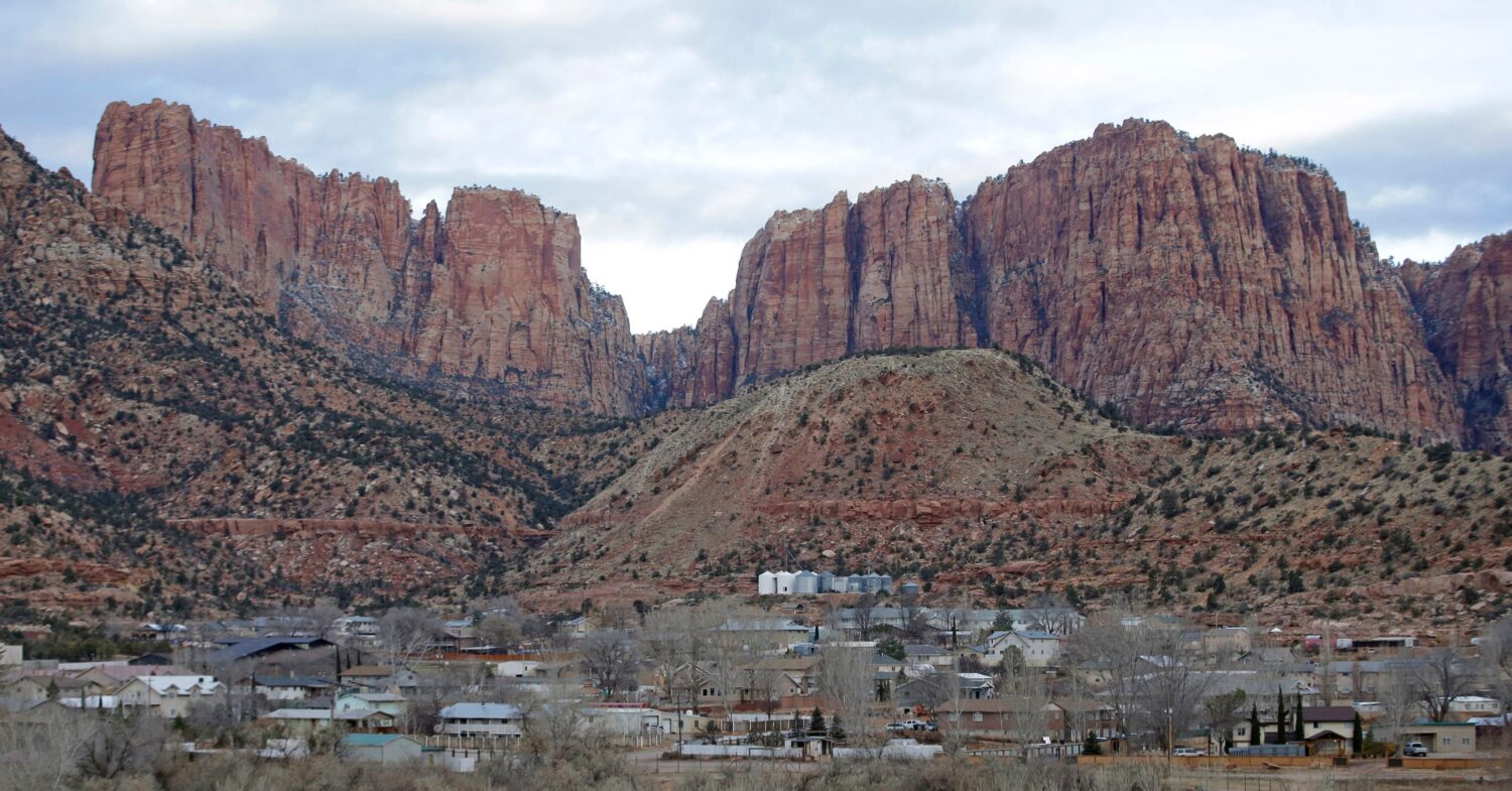 FILE - This photo shows Hildale, Utah, sitting at the base of Red Rock Cliff mountains, with its si...